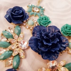 Gold bib necklace with roses and rhinestones